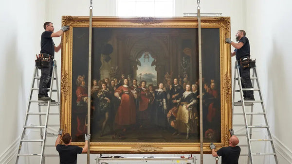 Professional heavy picture hanging service installing a large, framed artwork in Perth