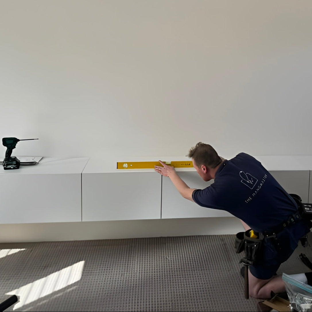 Floating cabinet installation by The Hangnaster technician.